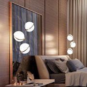 Crescent moon-shaped LED chandelier – Contemporary chic in acrylic and brass finish