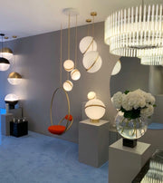 Crescent moon-shaped LED chandelier – Contemporary chic in acrylic and brass finish