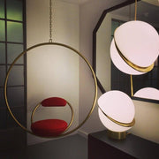 Crescent moon-shaped LED chandelier – Contemporary chic in acrylic and brass finish
