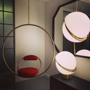 Crescent moon-shaped LED chandelier – Contemporary chic in acrylic and brass finish