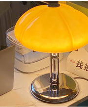 Elegantly designed Bauhaus table lamp by Pilz – Chic fusion of glass and metal with warm amber lampshade