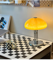 Elegantly designed Bauhaus table lamp by Pilz – Chic fusion of glass and metal with warm amber lampshade
