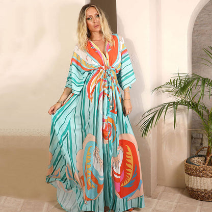 Robe Maxi Imprimée Abstraite Colorée avec Décolleté en V et Manches 3/4 – Élégance et Confort