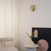 Wall sconce in brass and glass with a sleek design - Contemporary LED lighting with an artistic touch