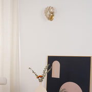 Wall sconce in brass and glass with a sleek design - Contemporary LED lighting with an artistic touch
