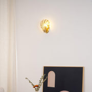 Wall sconce in brass and glass with a sleek design - Contemporary LED lighting with an artistic touch