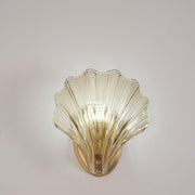 Wall sconce in brass and glass with a sleek design - Contemporary LED lighting with an artistic touch