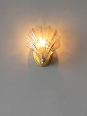Wall sconce in brass and glass with a sleek design - Contemporary LED lighting with an artistic touch