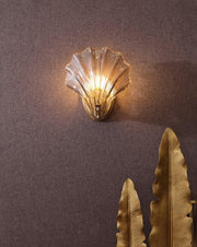 Wall sconce in brass and glass with a sleek design - Contemporary LED lighting with an artistic touch
