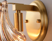 Wall sconce in brass and glass with a sleek design - Contemporary LED lighting with an artistic touch