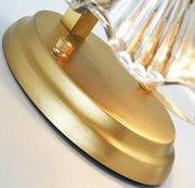 Wall sconce in brass and glass with a sleek design - Contemporary LED lighting with an artistic touch