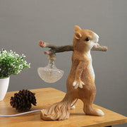 Charming LED squirrel table lamp – Stylish resin and glass accent for your space