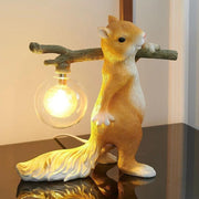 Charming LED squirrel table lamp – Stylish resin and glass accent for your space