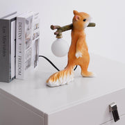 Charming LED squirrel table lamp – Stylish resin and glass accent for your space