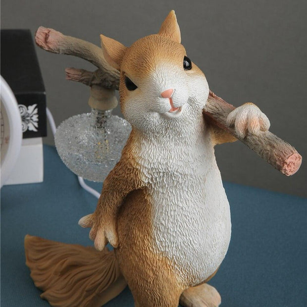 Charming LED squirrel table lamp – Stylish resin and glass accent for your space