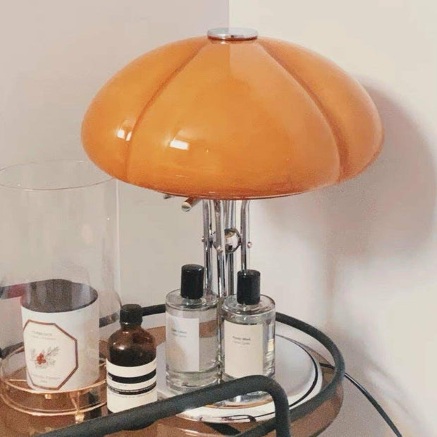 Elegantly designed Bauhaus table lamp by Pilz – Chic fusion of glass and metal with warm amber lampshade