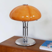 Elegantly designed Bauhaus table lamp by Pilz – Chic fusion of glass and metal with warm amber lampshade