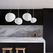Elegant modern LED lamp with natural stone accents and opal glass