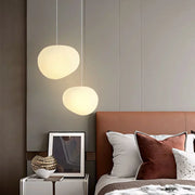 Elegant modern LED lamp with natural stone accents and opal glass
