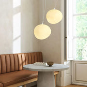 Elegant modern LED lamp with natural stone accents and opal glass