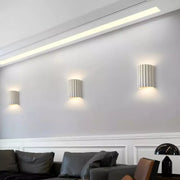 Chic wall sconce with pleated lampshade – Elevate your space with modern elegance and soft illumination