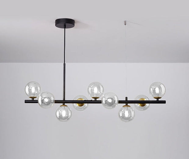 Suspension Sleek Armature – Élégance en verre et métal pour les espaces de restauration contemporains