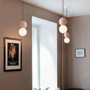 Dazzling geometric pendant light Origo – Made from volcanic stone and opal glass