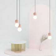 Dazzling geometric pendant light Origo – Made from volcanic stone and opal glass