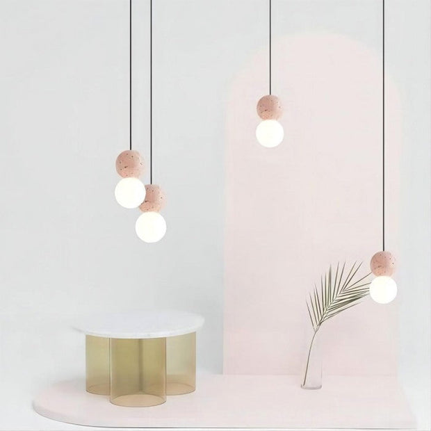 Dazzling geometric pendant light Origo – Made from volcanic stone and opal glass