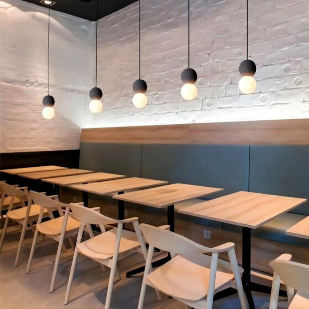 Dazzling geometric pendant light Origo – Made from volcanic stone and opal glass