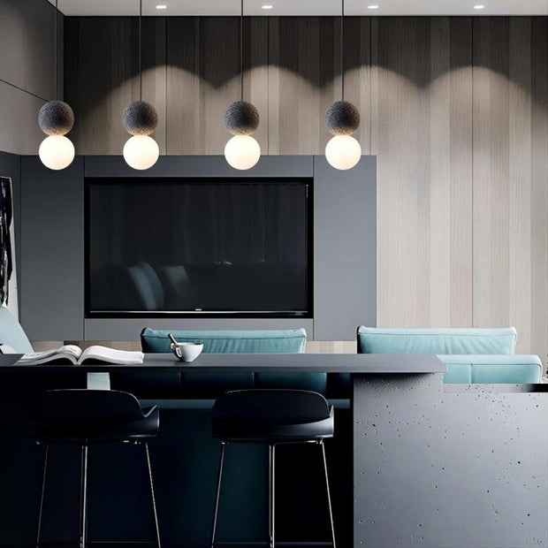 Dazzling geometric pendant light Origo – Made from volcanic stone and opal glass