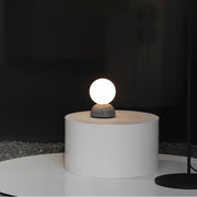 Dazzling geometric pendant light Origo – Made from volcanic stone and opal glass