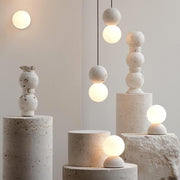 Dazzling geometric pendant light Origo – Made from volcanic stone and opal glass