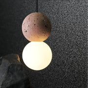 Dazzling geometric pendant light Origo – Made from volcanic stone and opal glass