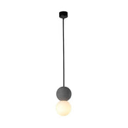 Dazzling geometric pendant light Origo – Made from volcanic stone and opal glass