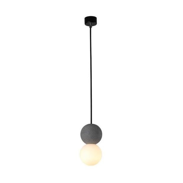 Dazzling geometric pendant light Origo – Made from volcanic stone and opal glass