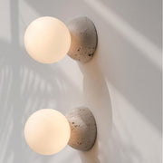 Dazzling geometric pendant light Origo – Made from volcanic stone and opal glass