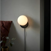Dazzling geometric pendant light Origo – Made from volcanic stone and opal glass