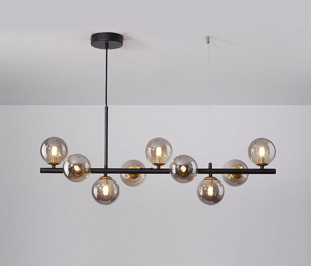 Suspension Sleek Armature – Élégance en verre et métal pour les espaces de restauration contemporains